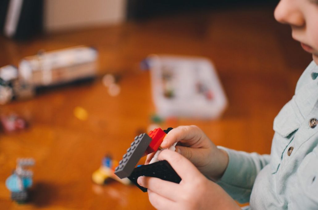 A child is playing during a therapy session.