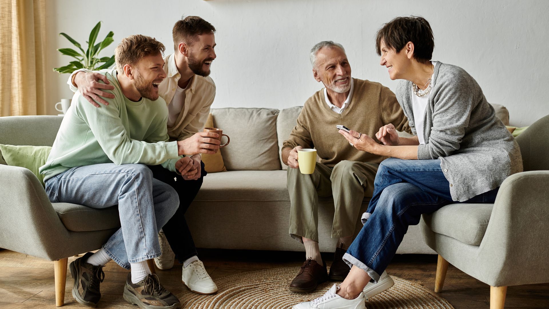 A family is happy after family therapy with their adult children in Toronto, Ontario.