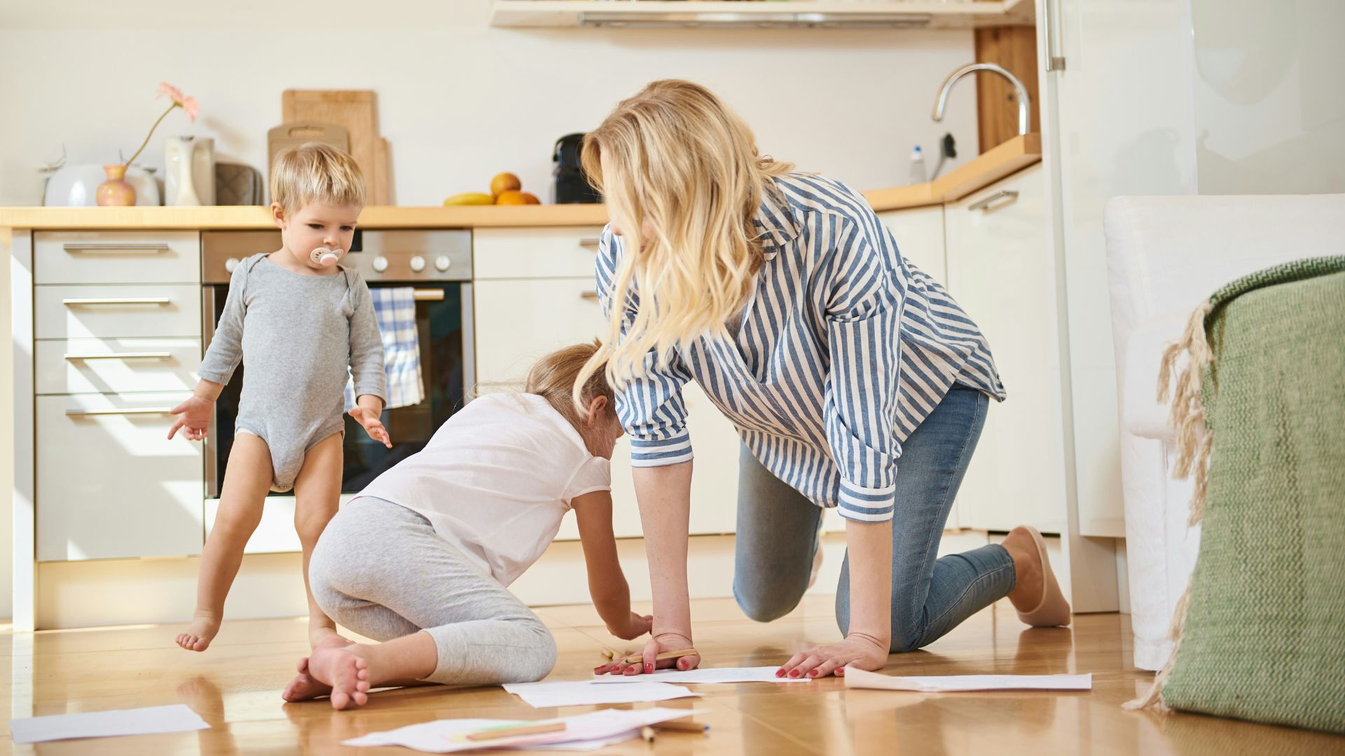 A mother plays with her kids after divorce.